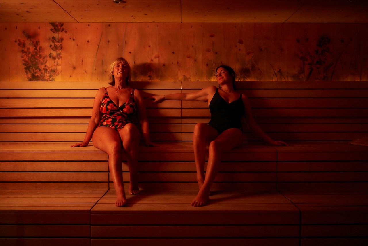Two women relaxing in the Herbal Sauna.